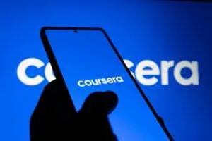 A smartphone displaying the Coursera logo against a bright blue background, symbolizing online learning.